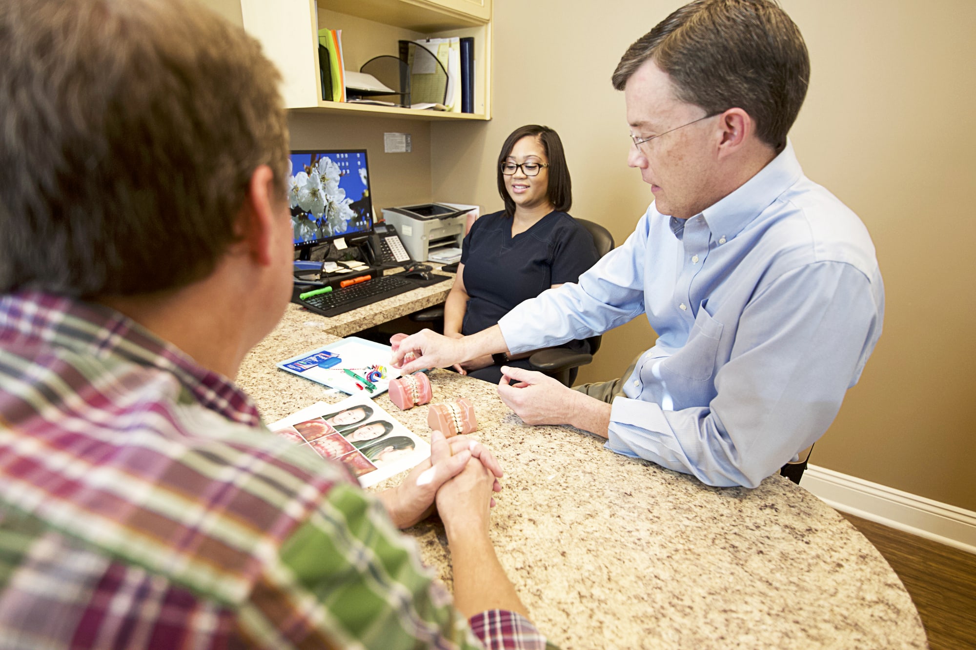 patients smiling during a consultation